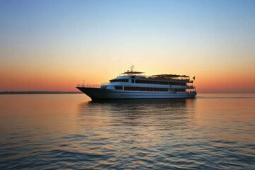 Obraz premium Cruise ship sailing on calm waters during sunset near a tranquil horizon. Generative AI