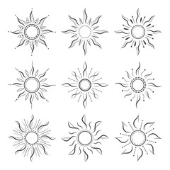 Set of decorative sunburst designs in black and white