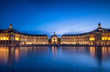Bordeaux evening reflections showcasing illuminated architecture beside the water
