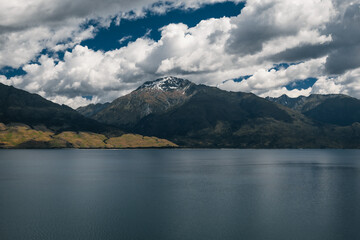 Mountains on the side of a lake in new Zealand.