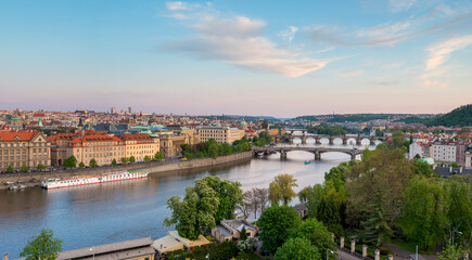 Stunning view of Prague's skyline along the Vltava River with historic architecture and bridges