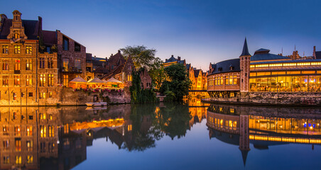 Evening reflections on the waterways of Ghent showcasing architectural beauty and serene ambiance
