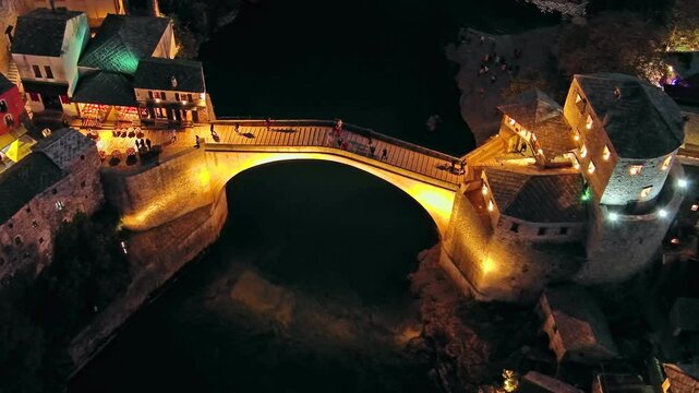 Aerial view on the Old Bridge in Mostar at night, Bosnia and Herzegovina, 4k