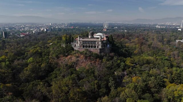 Chapultepec Castle in the Chapultepec Park in Mexico City. Drone flies over the park to the facade of the castle