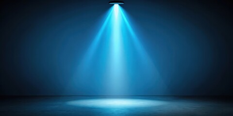 Darkened room with a single blue spotlight illuminating the space, light source