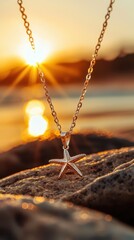 Woman relax on beach with sunset. Beautiful golden starfish pendant necklace glowing in sunlight on a rocky beach at sunset