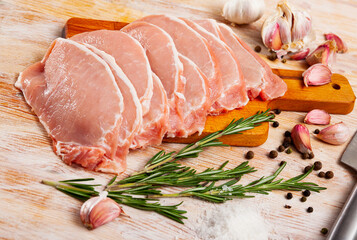 Raw pork fillet ready for cooking on wooden table