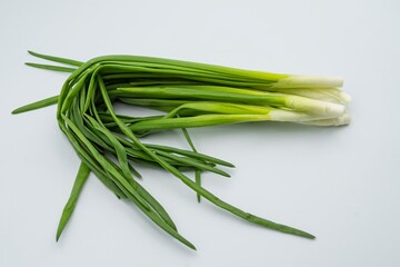 Fresh green onions on a white background. Healthy food.