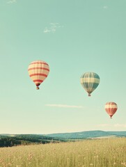 Obraz premium Colorful hot air balloons drifting peacefully over an expansive green field under a clear blue sky. Generative AI