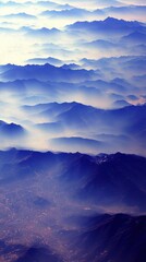 Fototapeta premium Aerial view of misty mountains