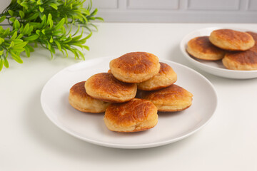 Kue kamir. Kamir cake on a white plate. Also called khamir. Perfect for recipe, article, catalogue, or any commercial purposes.