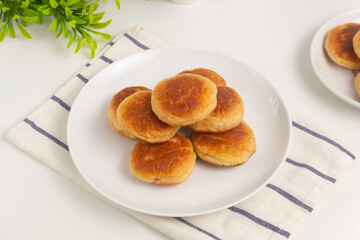 Kue kamir. Kamir cake on a white plate. Also called khamir. Perfect for recipe, article, catalogue, or any commercial purposes.