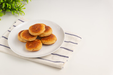 Kue kamir. Kamir cake on a white plate. Also called khamir. Perfect for recipe, article, catalogue, or any commercial purposes.