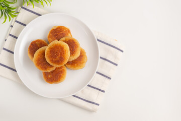 Kue kamir. Kamir cake on a white plate. Also called khamir. Perfect for recipe, article, catalogue, or any commercial purposes.
