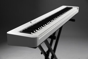 Fototapeta premium Synthesizer on grey background, closeup. Electronic musical instrument