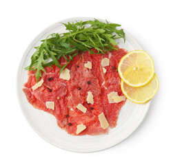 Fresh beef carpaccio with arugula, lemon and cheese isolated on white, top view
