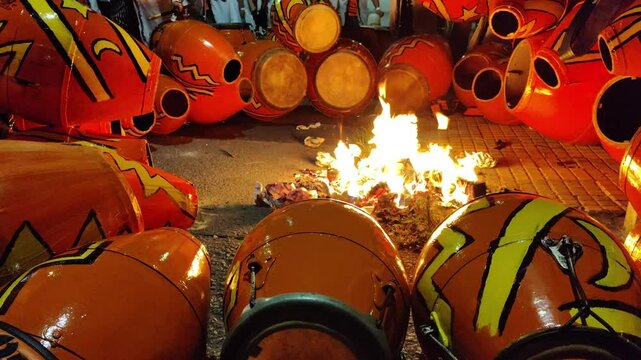 Long shot candombe drums being tempered at street video, 2025 calls parade, montevideo city, uruguay