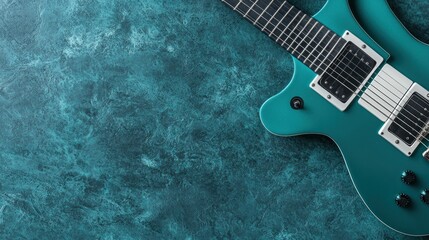 Teal electric guitar on teal background