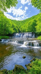 Lush waterfall cascading down green hills under a sunny sky. Possible use Nature backdrop