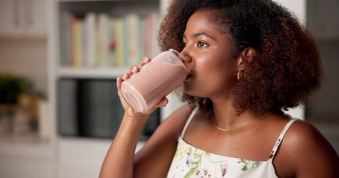 Woman, thinking and drinking smoothie in home with relax, detox and meal replacement in diet. Girl, vegan or healthy beverage in living room for gut wellness, cleansing and nutrition with refreshment