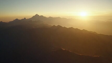 Obraz premium Aerial sunset view of hazy mountain range