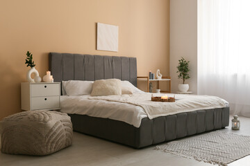 Interior of bedroom with burning candles