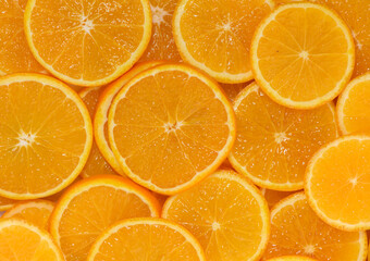 Bright orange slices arranged artistically create a vibrant display of fresh fruit goodness
