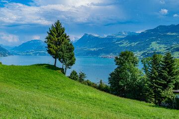 Mountain in the in summer, panoramic view with mountain. Alps mountains. Alpine mountain scenery. Mountain with lake in Alps. Mountains over the lake and the alps.