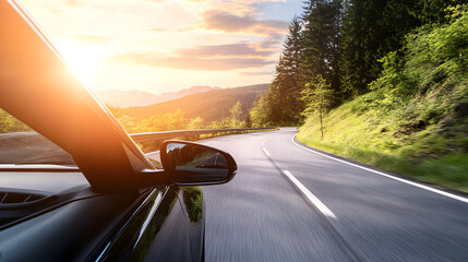 A car drives along a winding road through a scenic landscape