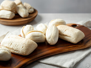 frozen dough bread on wooden plate
