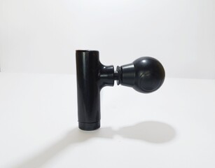 Electric mini gun massager isolated in white background