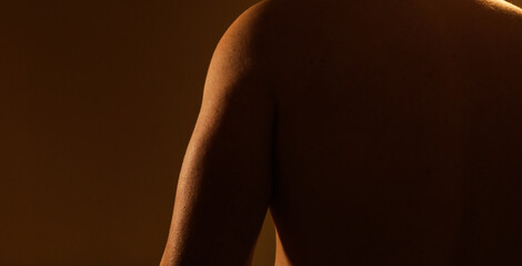 Man strong back shadow. Strong body. Shadow. Male. Model. Torso. Muscle.