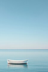Naklejka premium Serene Solitude: A White Rowboat on a Calm Ocean Under a Clear Blue Sky