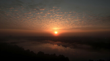 Sunrise over misty lake, aerial view, calm morning