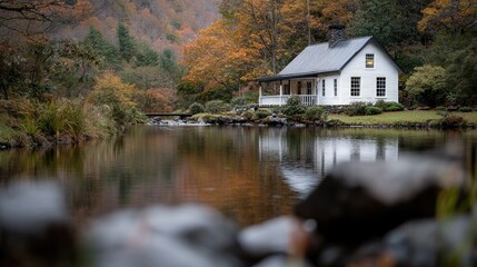 Fototapeta premium Autumn cabin by a tranquil lake