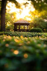 Naklejka premium Serene garden gazebo surrounded by lush greenery at sunset, creating a peaceful atmosphere