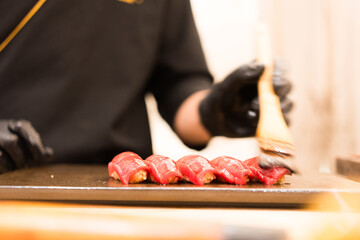 Close up of chef making fresh sushi in the restaurant. Japanese Omakase in the restaurant