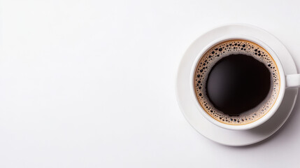 top down view of cup of black coffee on white background, inviting warmth
