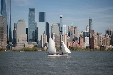 New York City yacht sailing. NYC boat on the Hudson River. Manhattan skyline with yacht. Yacht in NYC. Manhattan skyscrapers from the river. NYC yacht tour. NYC sailboat with cityscape.
