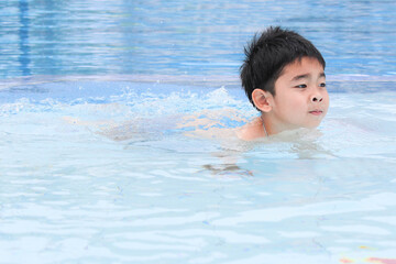 Boys swimming during school holidays