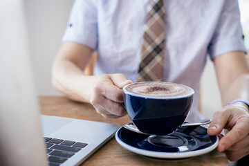 Businesswoman drinking a coffee at office