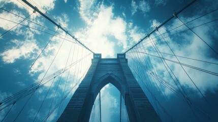 Fototapeta premium Suspension bridge, low angle, city skyline, dramatic sky, travel