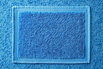 Blue Terrycloth Square Frame:  A close-up shot of a textured blue terrycloth fabric with a smaller square inset, framing the textured backdrop. The image has a soft and tactile quality.  