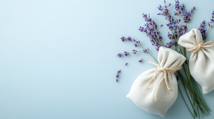 Lavender sachets and flowers on blue background, aromatherapy, relaxation