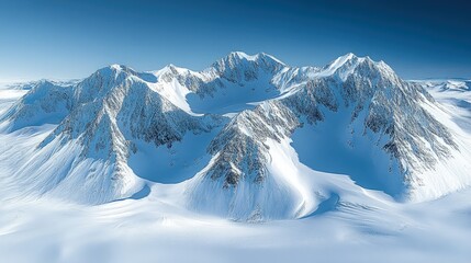 Majestic snow-covered mountain range under a clear blue sky with vast icy plains below