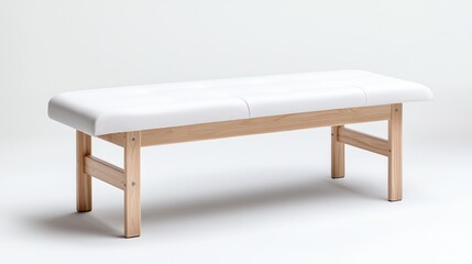 Fototapeta premium White padded medical bench, light wood legs, studio