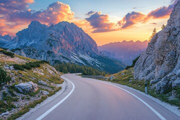 Naklejka premium Mountain road at sunset with dramatic sky and rocky landscape in a scenic alpine environment