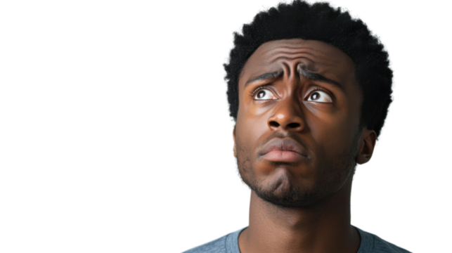 Pensive young man looking up with worried expression on transparent background