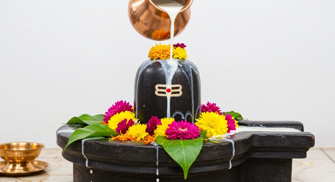 offering puja to Shivlinga or Shivlingam, Jalabhishek Rudrabhishek of Lord Shiva, with water, milk, Ganges water, Hindu religion festival maha shivratri concept 