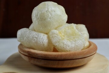 Crackers skin or cowhide, is a traditional Indonesian cracker served on a wooden plate